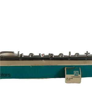 General Motors "Chevrolet" Emblem. " 3733212 Silver. New in box. Vintage.